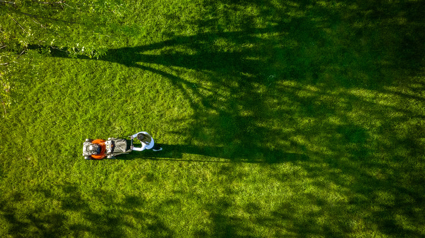 budget lawn mowers aerial view push mowing a yard