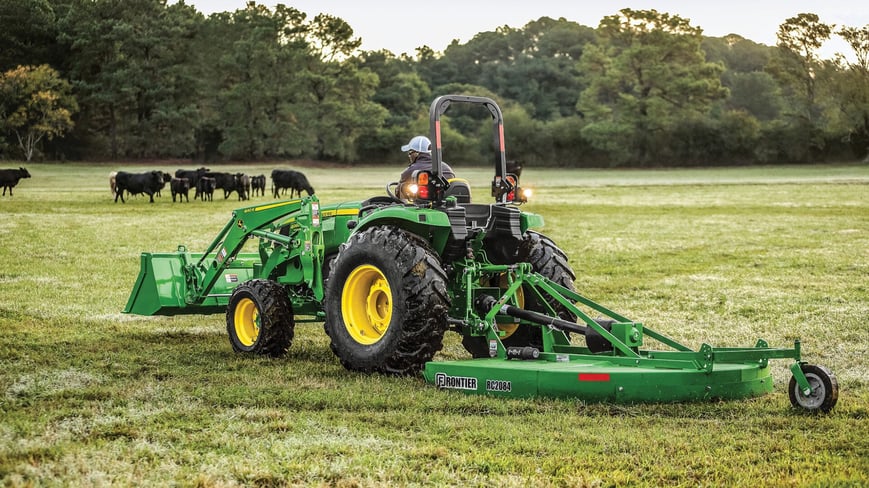 John Deere 4066M maintaining a pasture for cattle