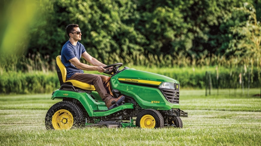 X584 Residential Lawn Tractor mowing a large yard