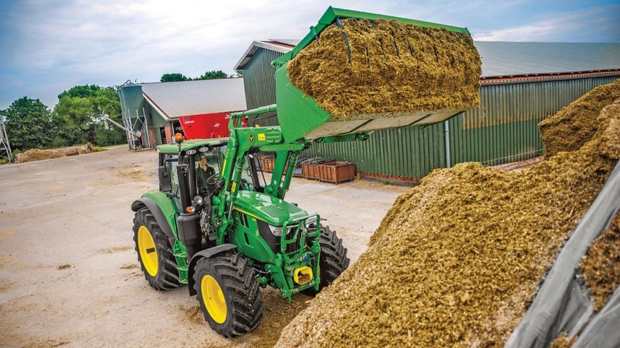 6M John Deere Tractor moving feed