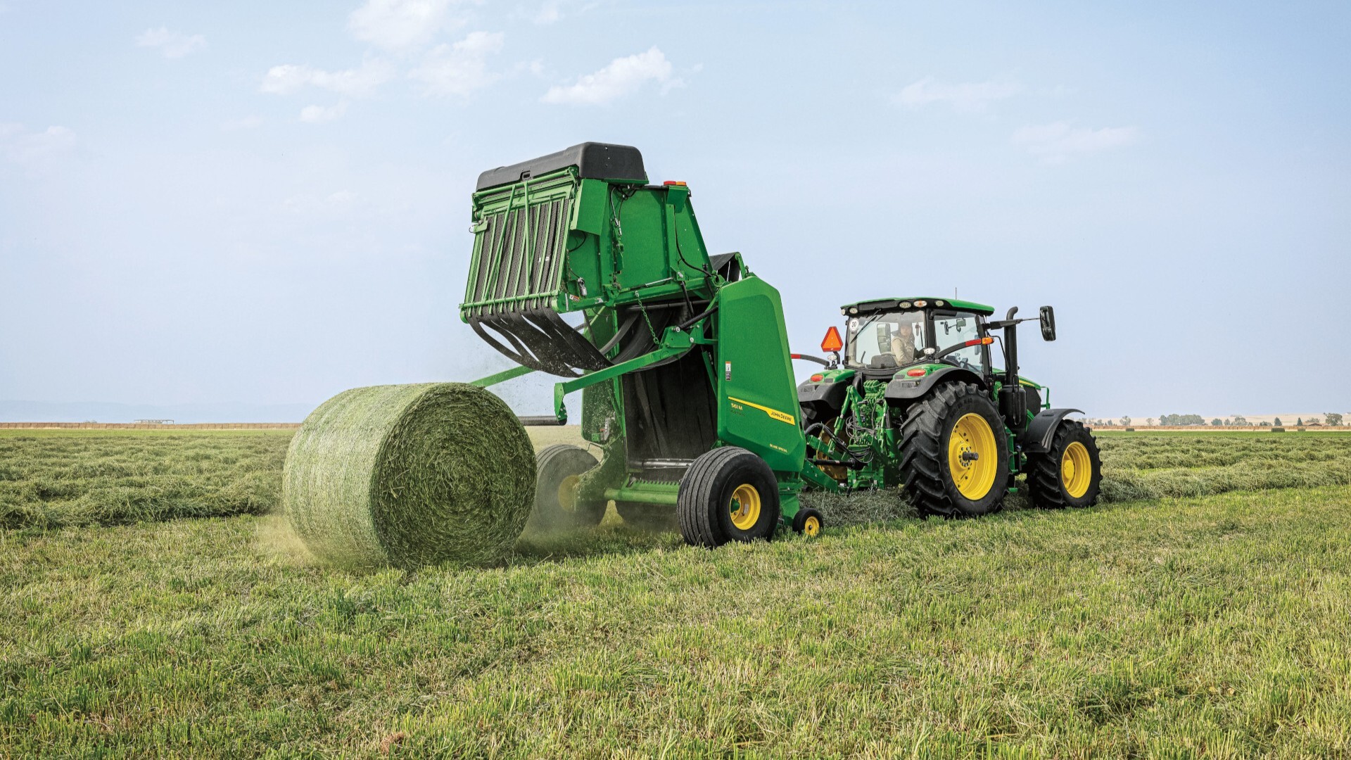 John Deere 561M round baler in action — Koenig Equipment