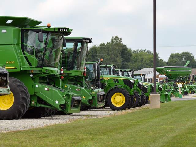 Rows of new John Deere combines and tractors on the Koenig Equipment lot in Greenville, Ohio